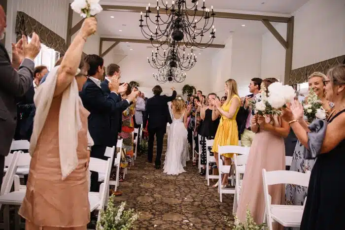A couple leaving their wedding ceremony