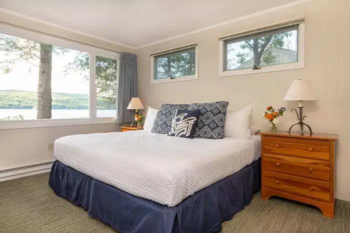 A bedroom with a king bed in one of the accommodations