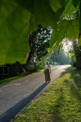 Girl walking along road at basin harbor