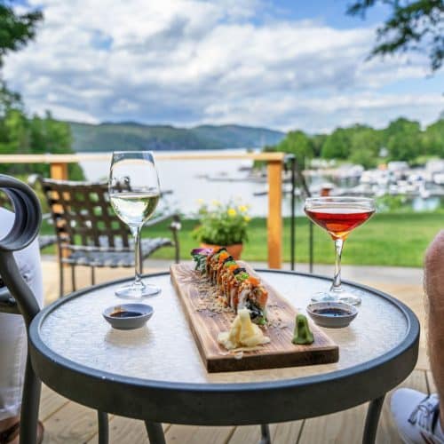 Sushi and cocktails on the Lodge Deck with view of Basin Harbor