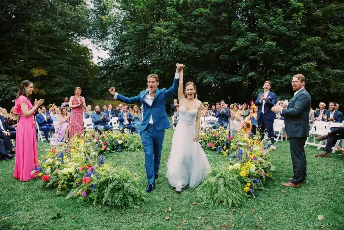 A bride and groom leaving their wedding ceremony