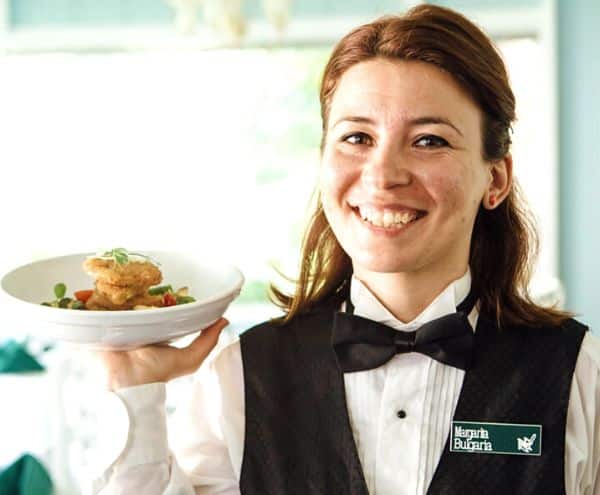 a server holding a dish