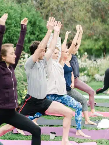 People doing yoga outside