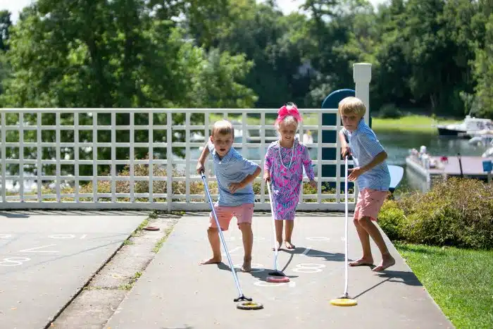 Kids playing shuffleboard