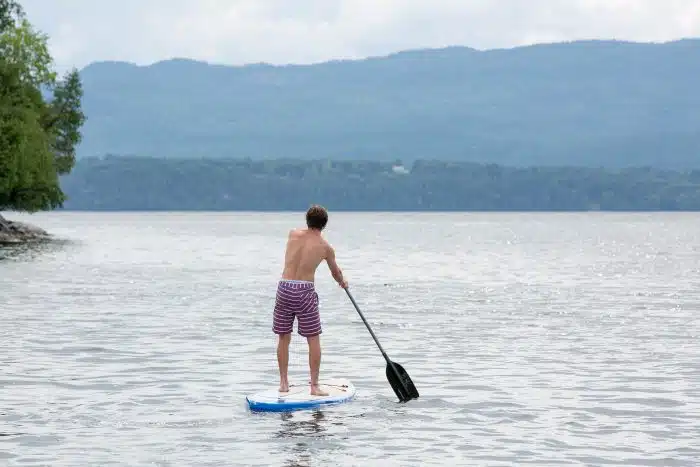 A boy on a paddle board