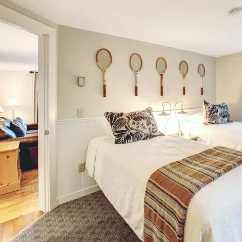 A bedroom with two twin beds in one of the accommodations