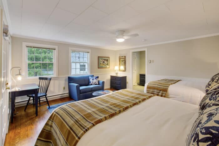 A bedroom with two queen beds in one of the accommodations