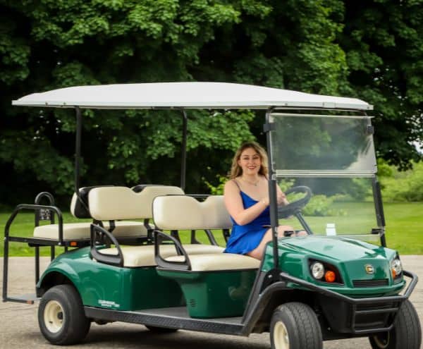 Women driving rental resort cart
