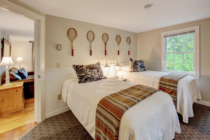 A bedroom with two twin beds in one of the accommodations