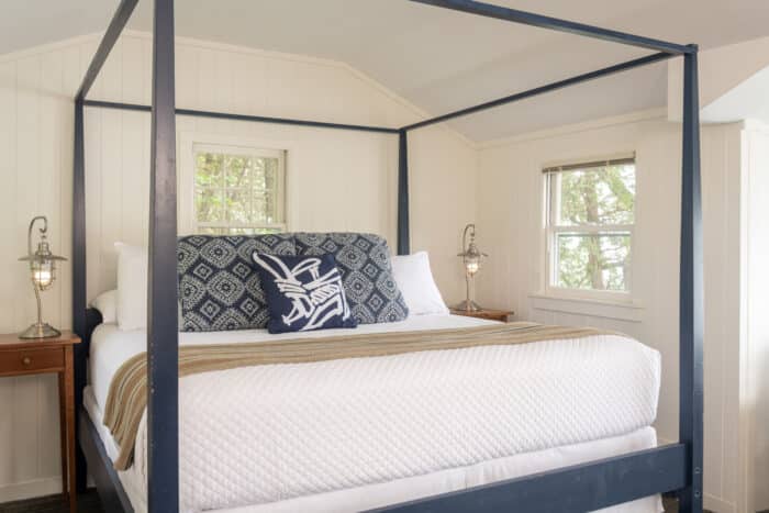 A bedroom with a king bed in one of the accommodations