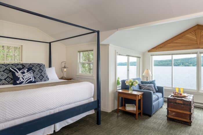 A bedroom with a king bed in one of the accommodations