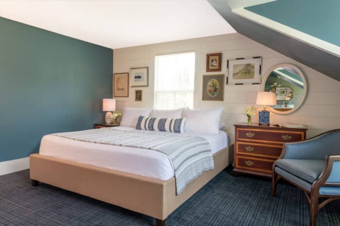 A bedroom with a king bed in one of the accommodations