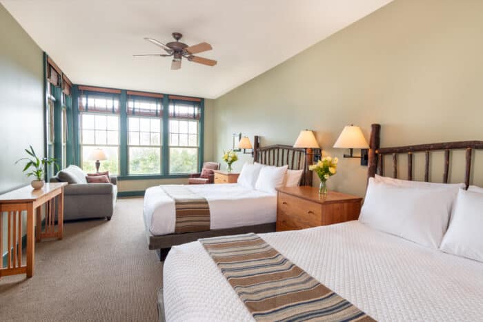 A room with two queen beds in one of the accommodations