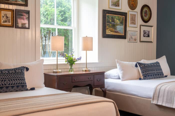 9-BHC-27 (2) A bedroom with two queen beds in one of the accommodations