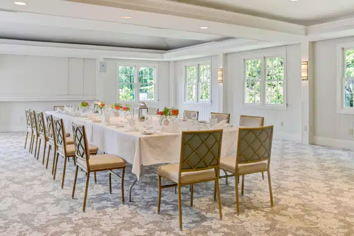 Dinner set up at a large table in the Club Room