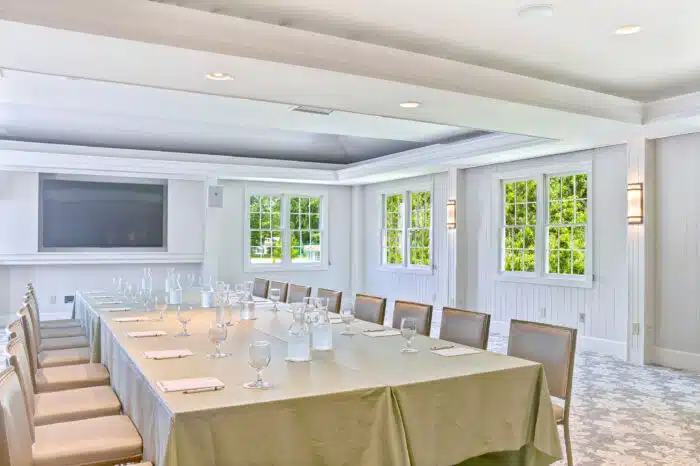 Meeting table set with podium for a group meeting in the Club Room