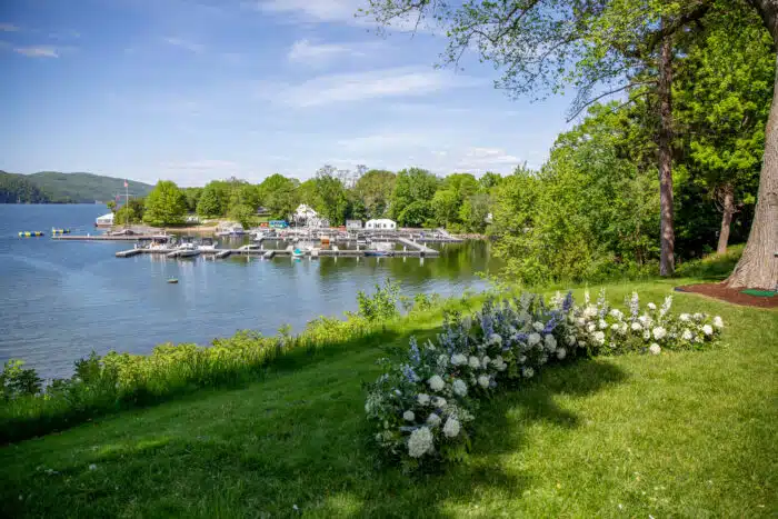 Floral installation at a wedding ceremony on the Lodge Lawn with views of the harbor