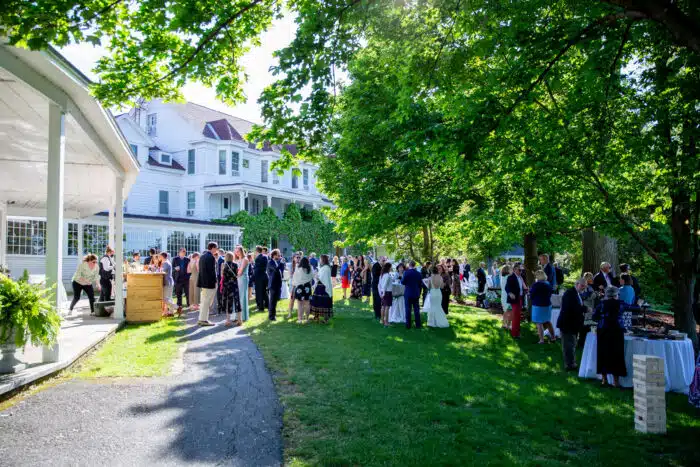 Guests gather for a cocktail reception on the Lodge Lawn
