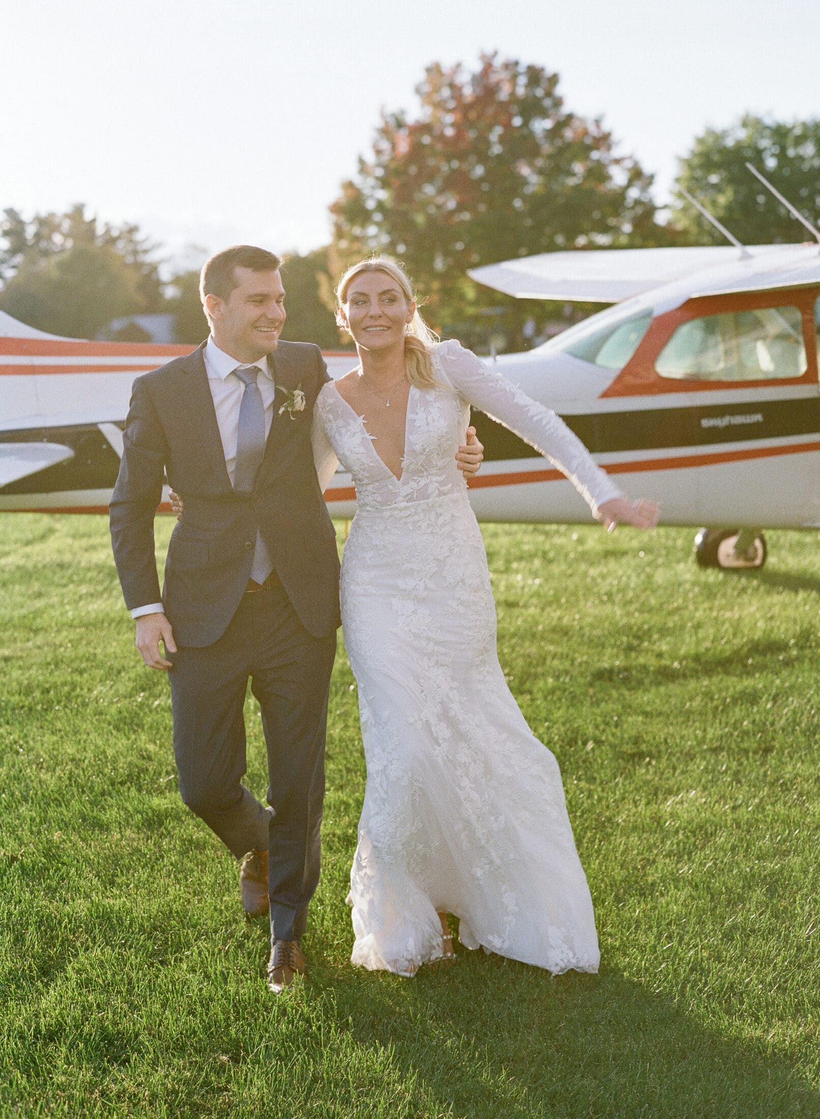Bride and groom getting off their private flight entrace on the airstrip