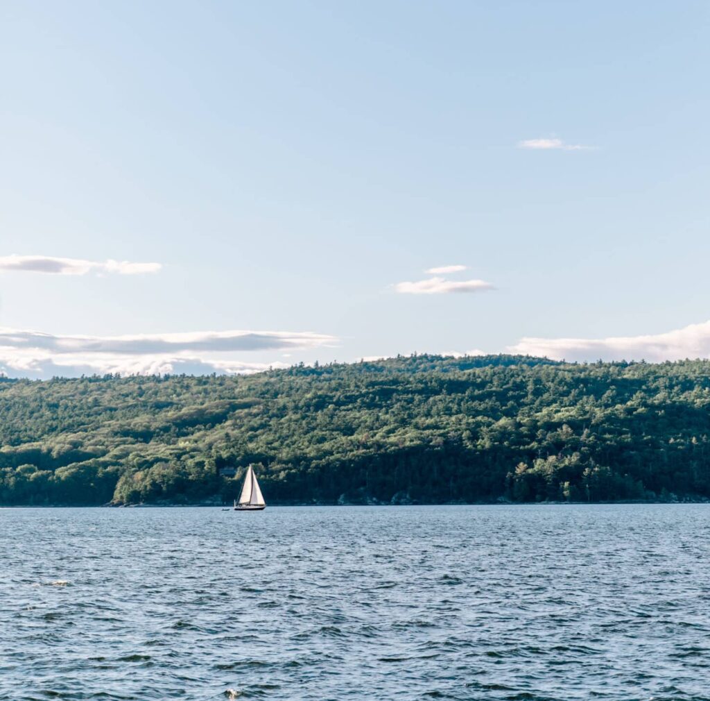 Lake Champlain with small sailboat in the distance