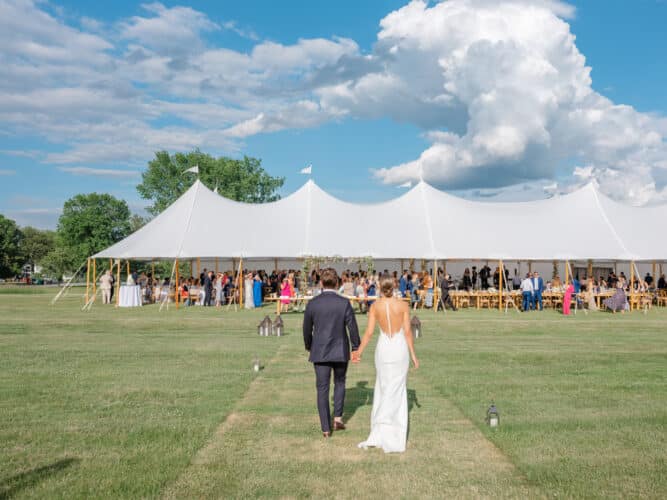 A bride and groom entering their reception