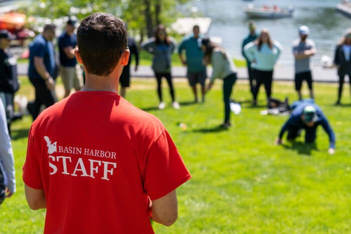 Basin Harbor staff facilitates an action challenge part of team building at Basin Harbor