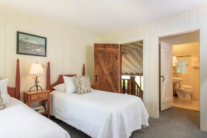A bedroom with two twin beds in one of the accommodations