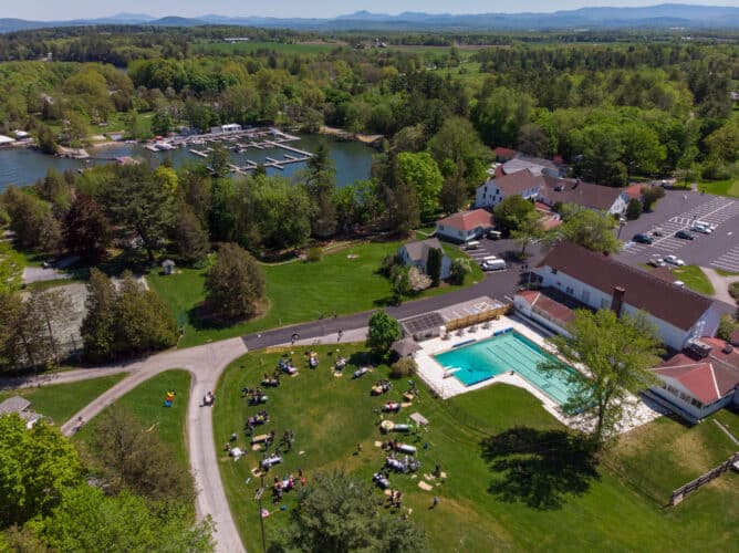 Aerial image of the team building groups on the West Lawn next to the pool at Basin Harbor