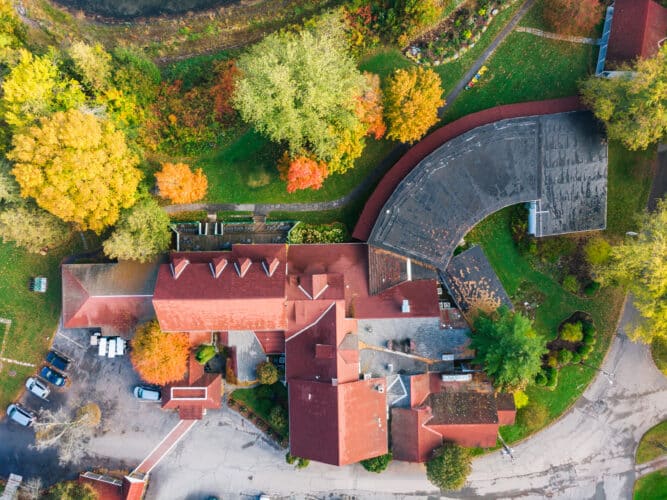 an aerial view of the main lodge during fall