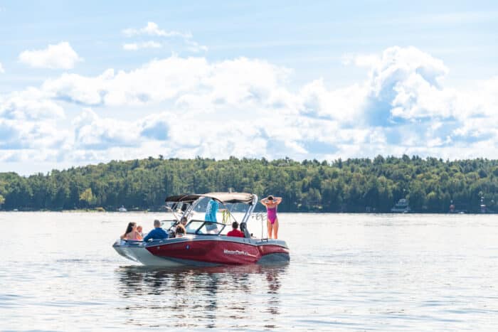 A group of people enjoying time on the MasterCraft boat.