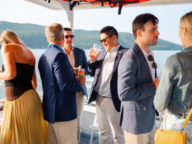 A group of people speaking at an event on the EScape Cruise.