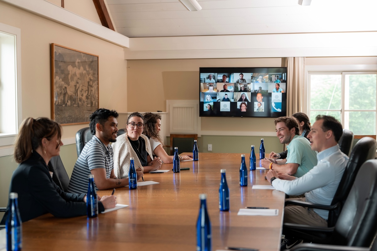 A board room full of guest at a business event
